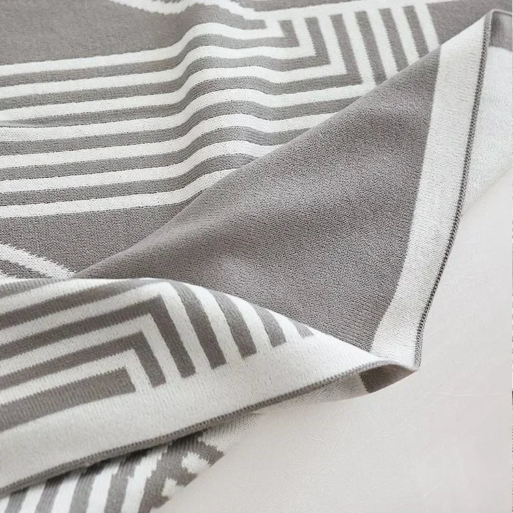 Modernes geometrisches Wurfplaid gestrickt mit warmem weichem Finish