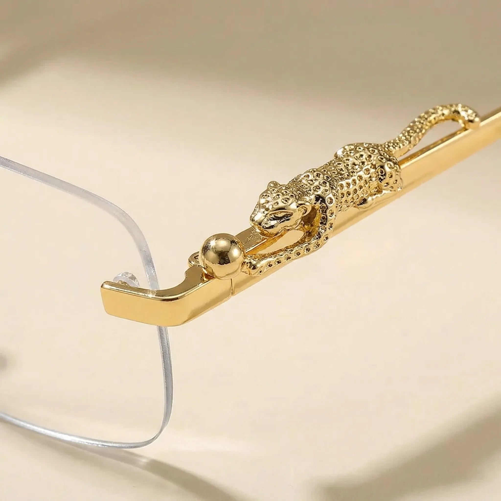 Randlose Quadratische Sonnenbrille mit Leoparden-Bügeldetails Goldton