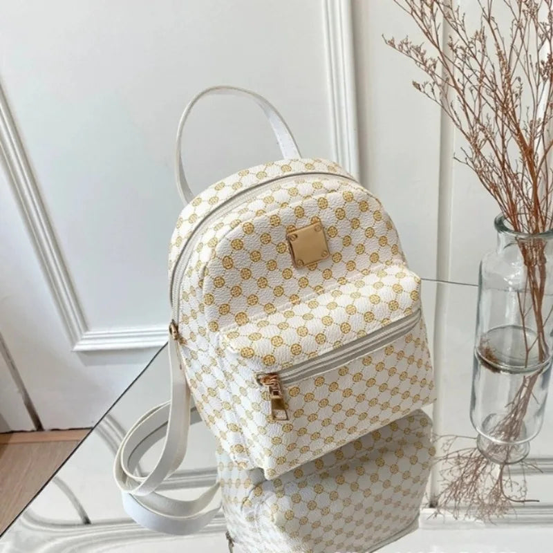 Kompakter modischer Rucksack mit gemustertem Design und Reißverschlusstasche